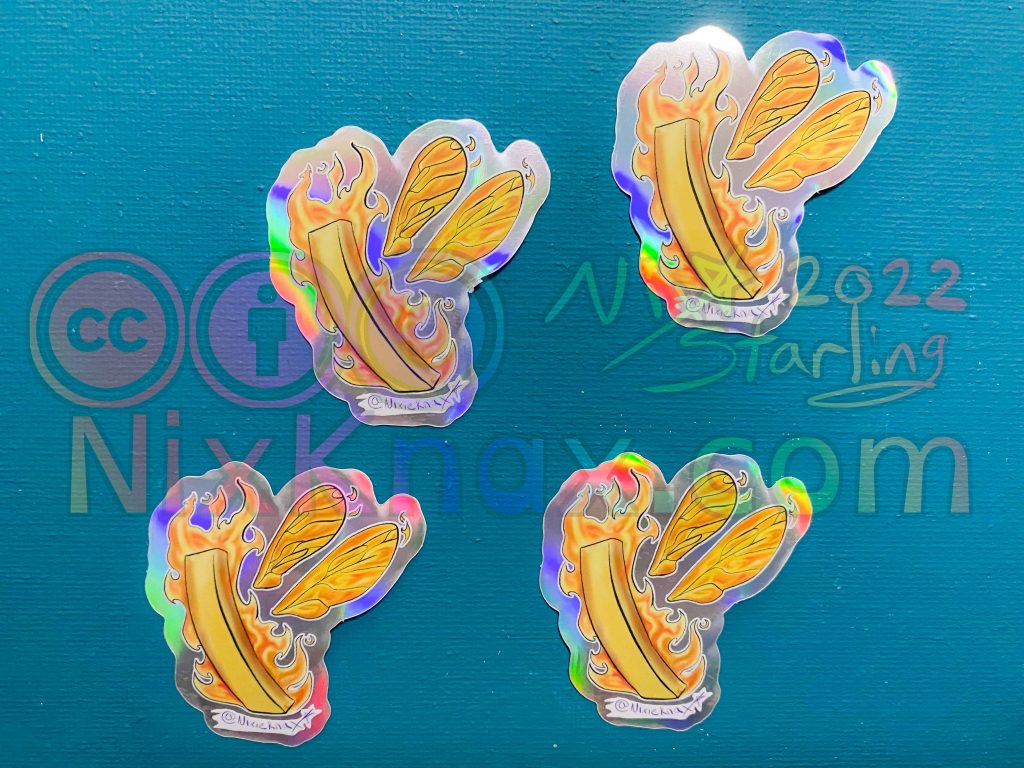 photo of stickers. these are the holographic Fire fries sticker
