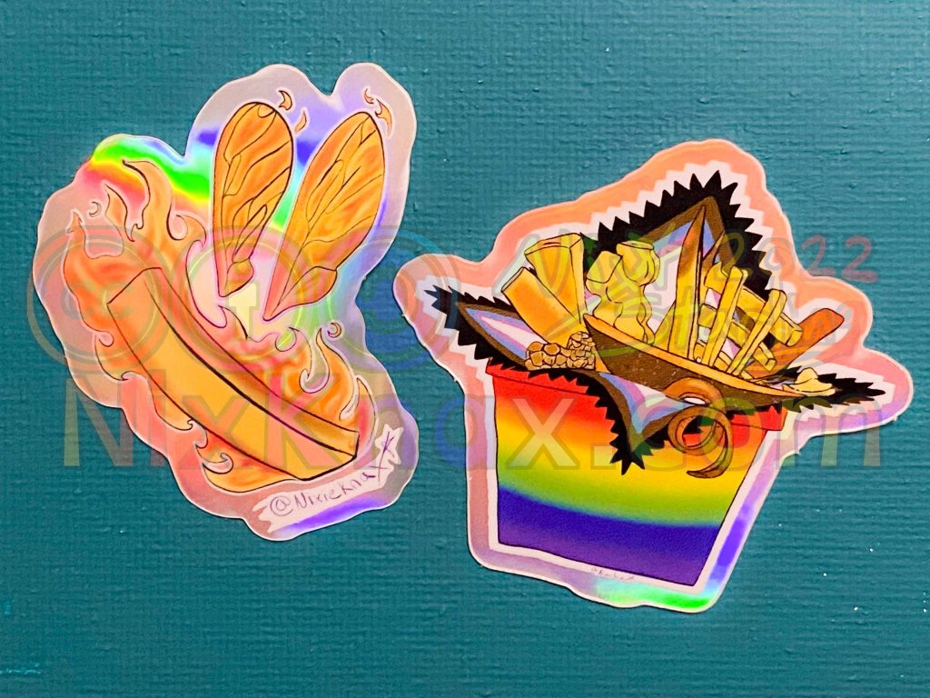 photo of stickers. these are called the shiny bits, which are the two holographic stickers from my fry series
